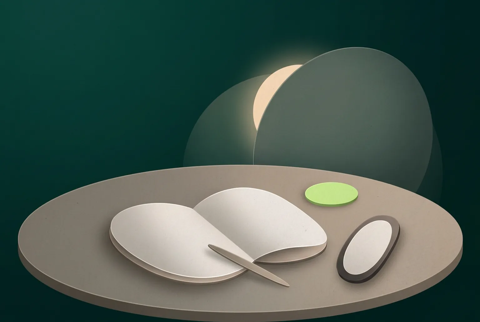 Night tabletop built from soft ovals: an open blank notebook, a thin pen, a phone turned face down and a small green disc under a warm lamp glow